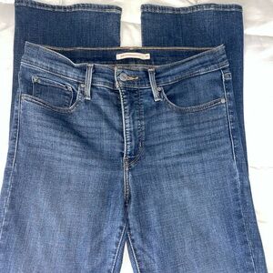 Levi’s blue skinny jeans with mid rise fit and straight leg flared